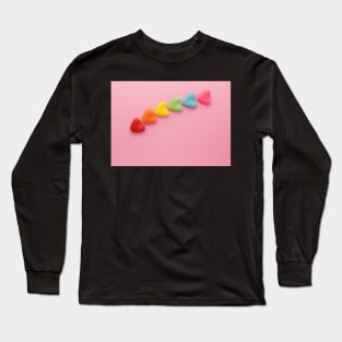 A variety of colorful candy hearts, in a rainbow shape, on a light pink background. Long Sleeve T-Shirt